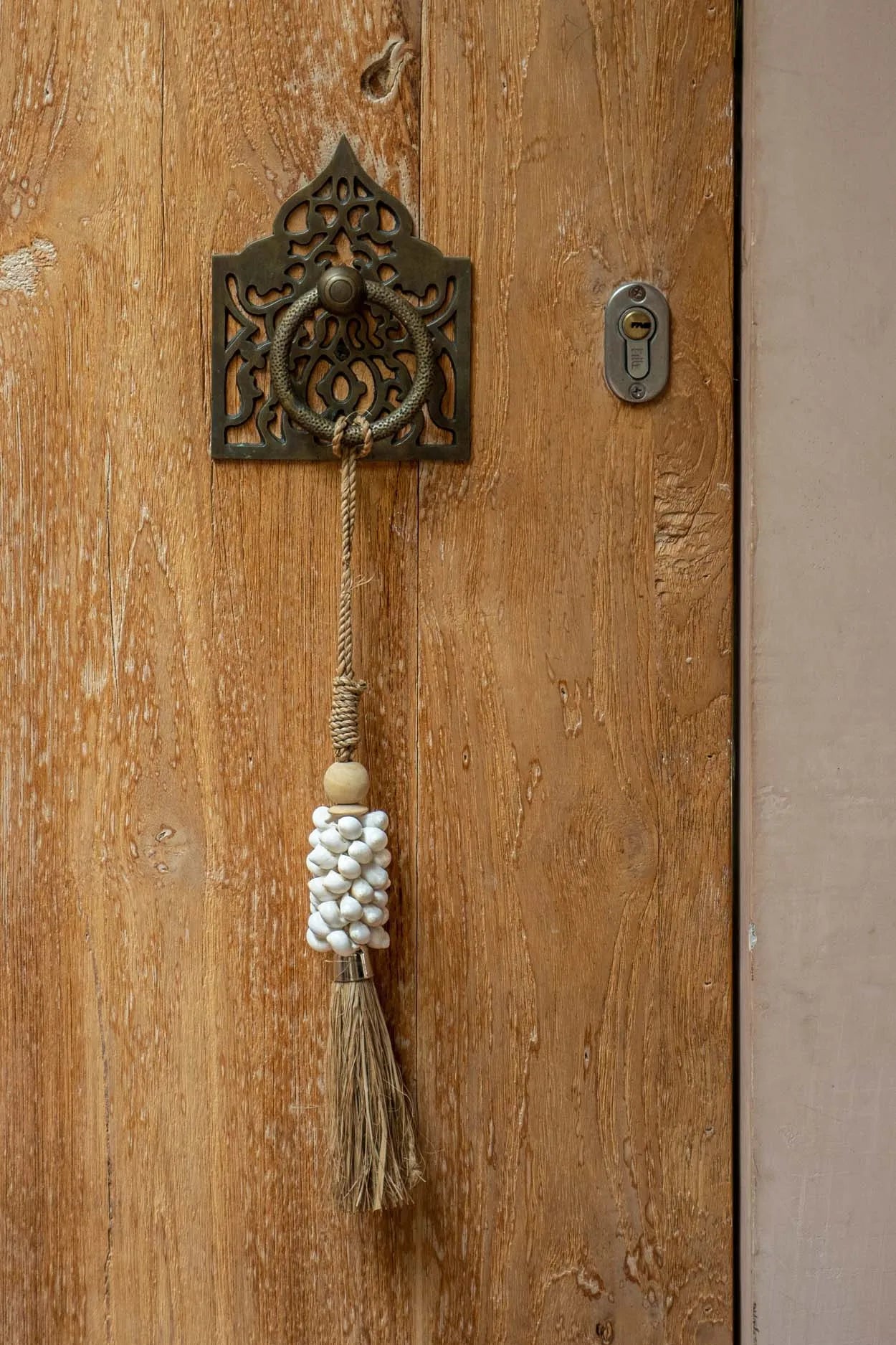 The Cowrie and Raffia Tassel - Natural in raffia — handmade luxury wall decoration curated by Laiyahome — view 4