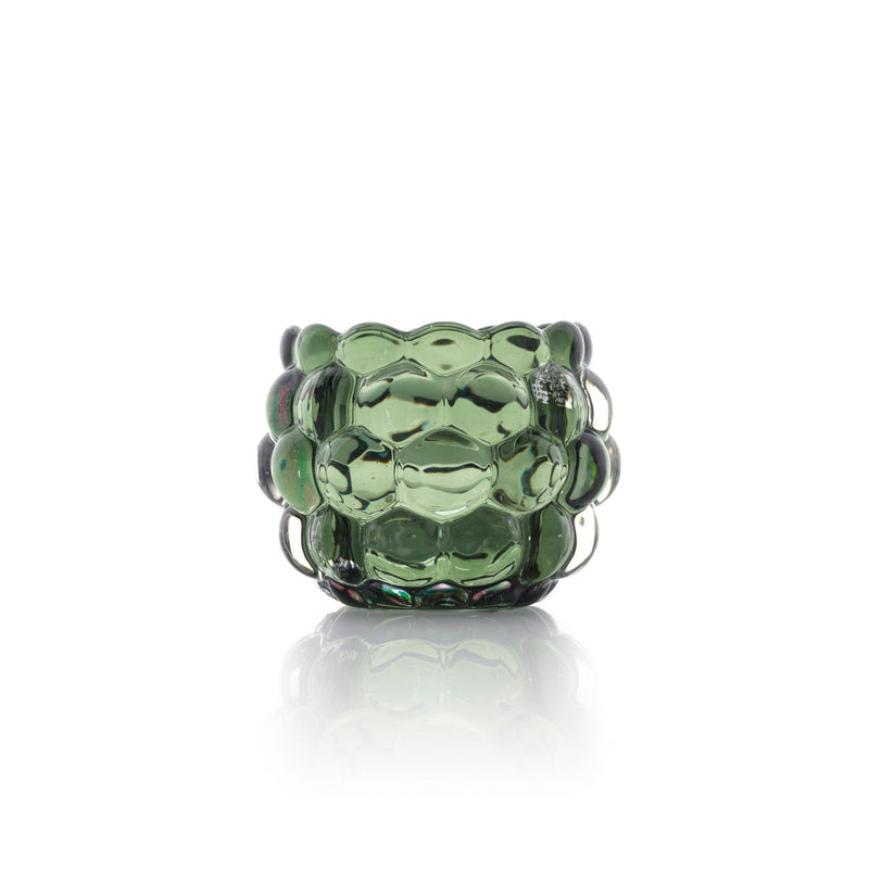 The Bubble Glow Candle Holder – Green, green glass candle holder against a light background