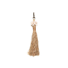 The Raffia Cowrie Shell Keychain in raffia — handmade luxury keychain curated by Laiyahome