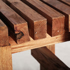 The Akviran Footrest — global-modern pouffe in mahogany wood from Laiyahome