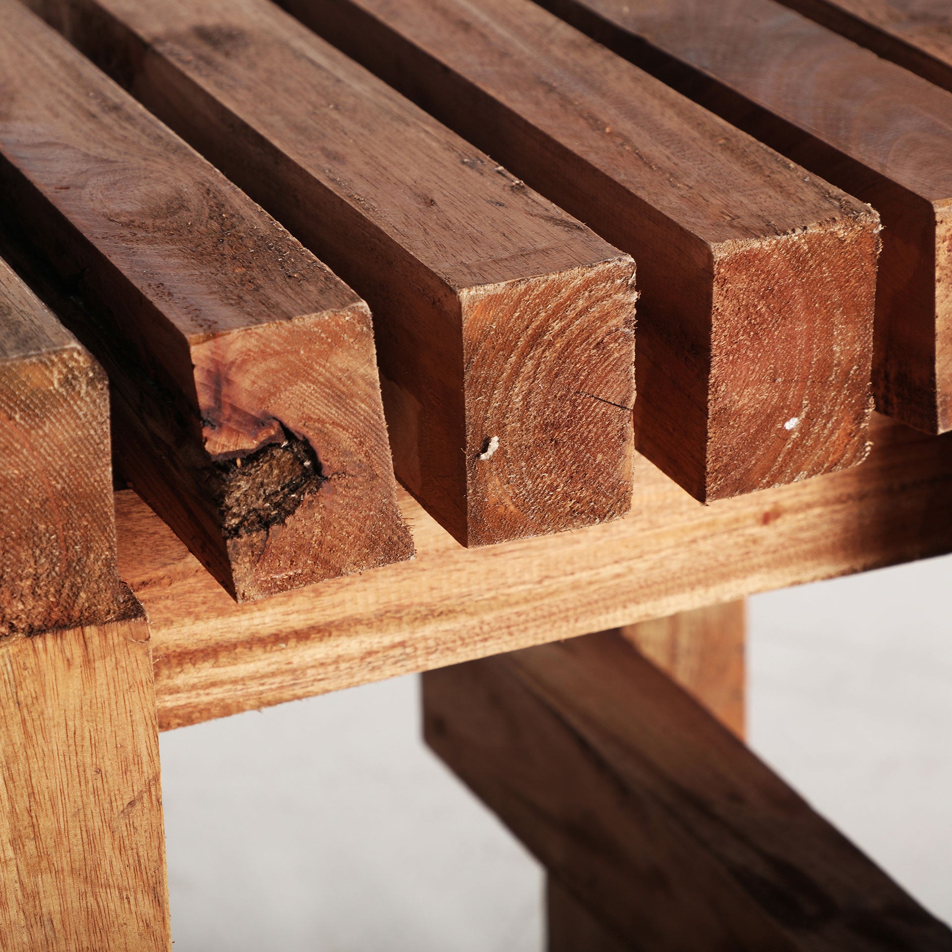The Akviran Footrest — global-modern pouffe in mahogany wood from Laiyahome