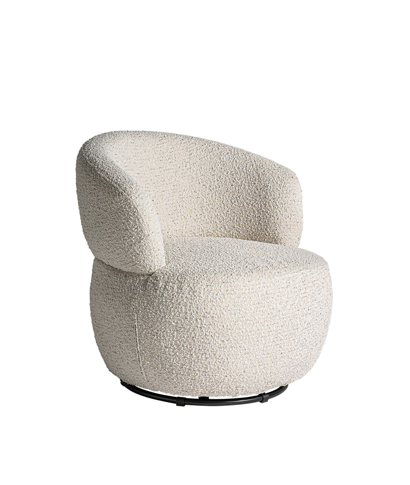 VAYRES ROTATIVE ARMCHAIR in a modern interior setting